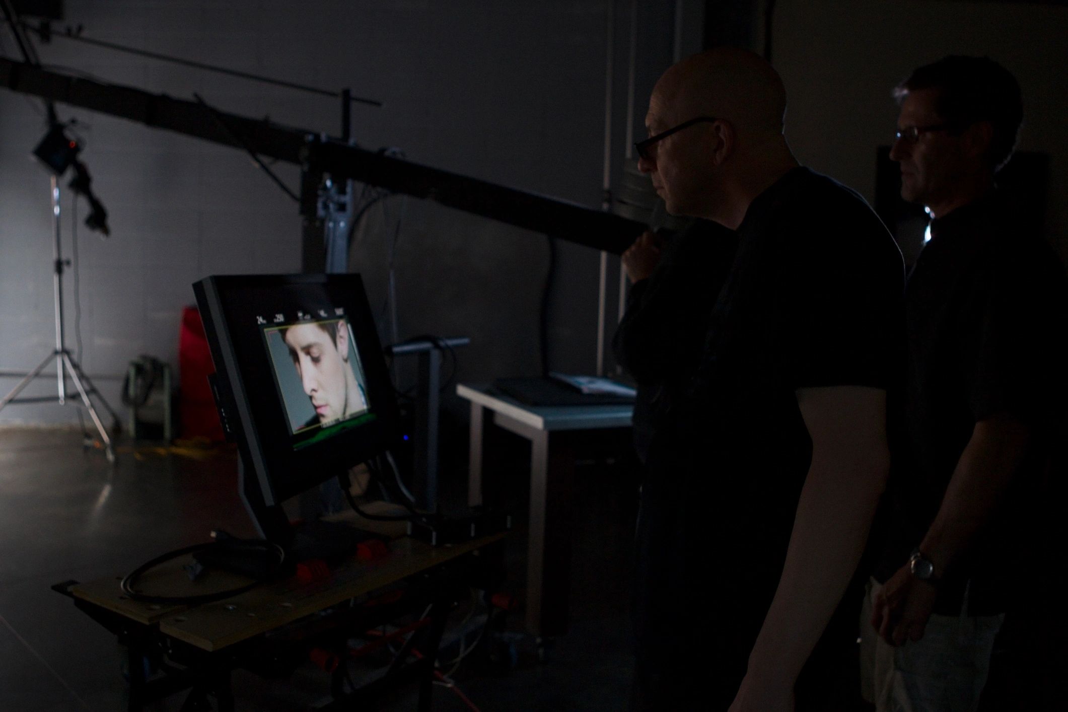Film crew working behind the scenes on a documentary production set