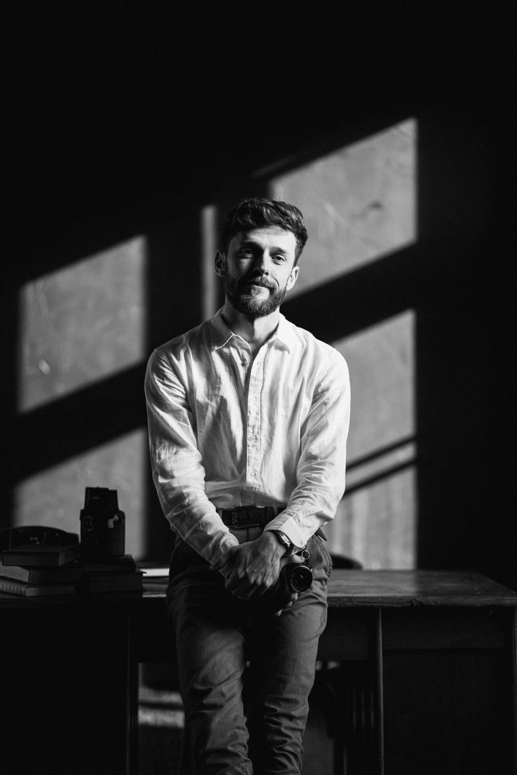 Filmmaker portrait in black and white studio setting
