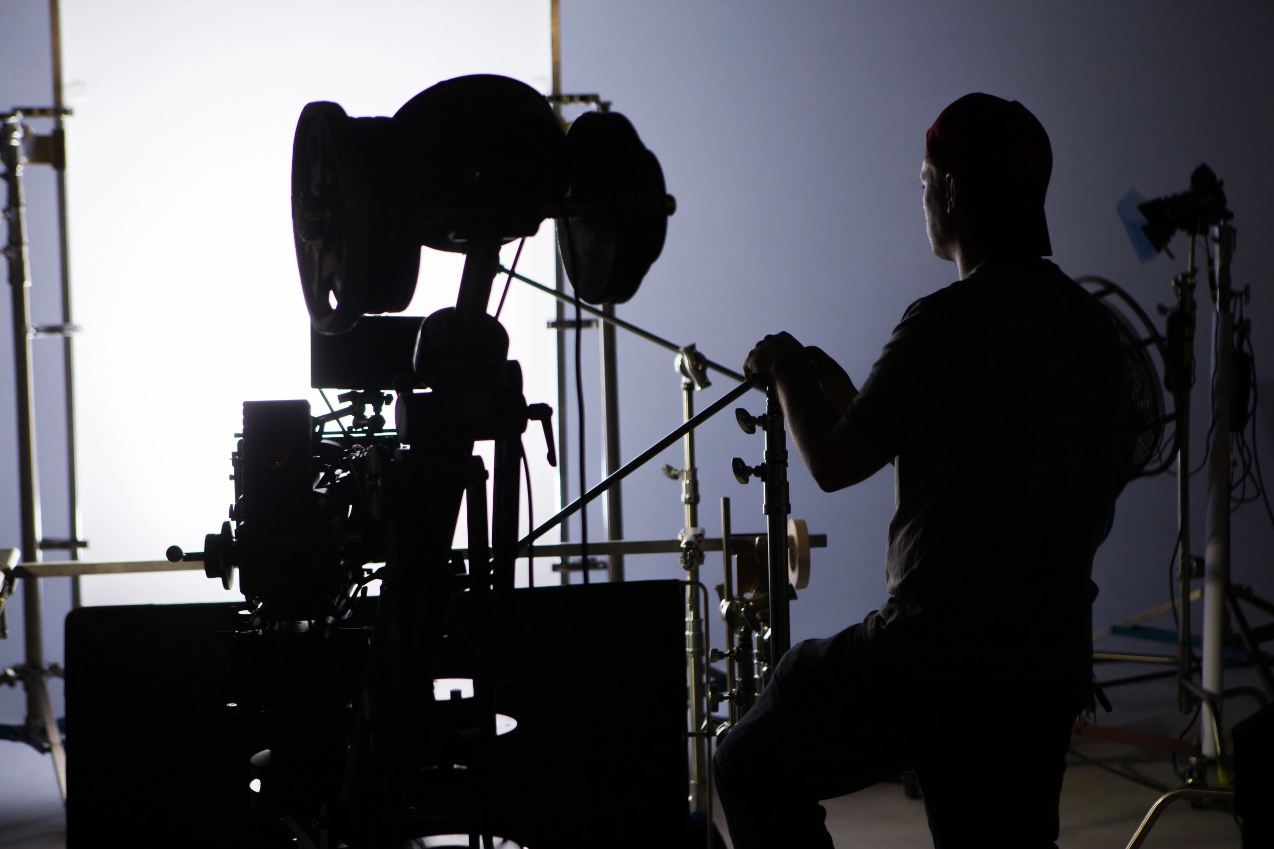Professional film crew gathered around a camera during production